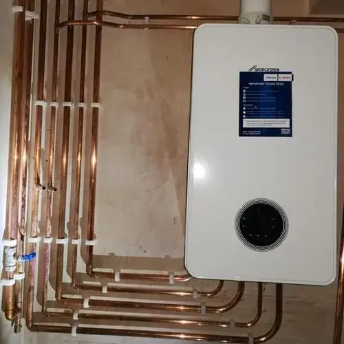 Installed boiler and neatly arranged copper pipes
